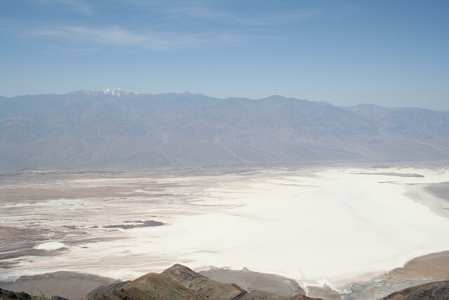 Salt below, and in the background – snow on the Sierra Nevada mountains / View from Dante's View of Badwater